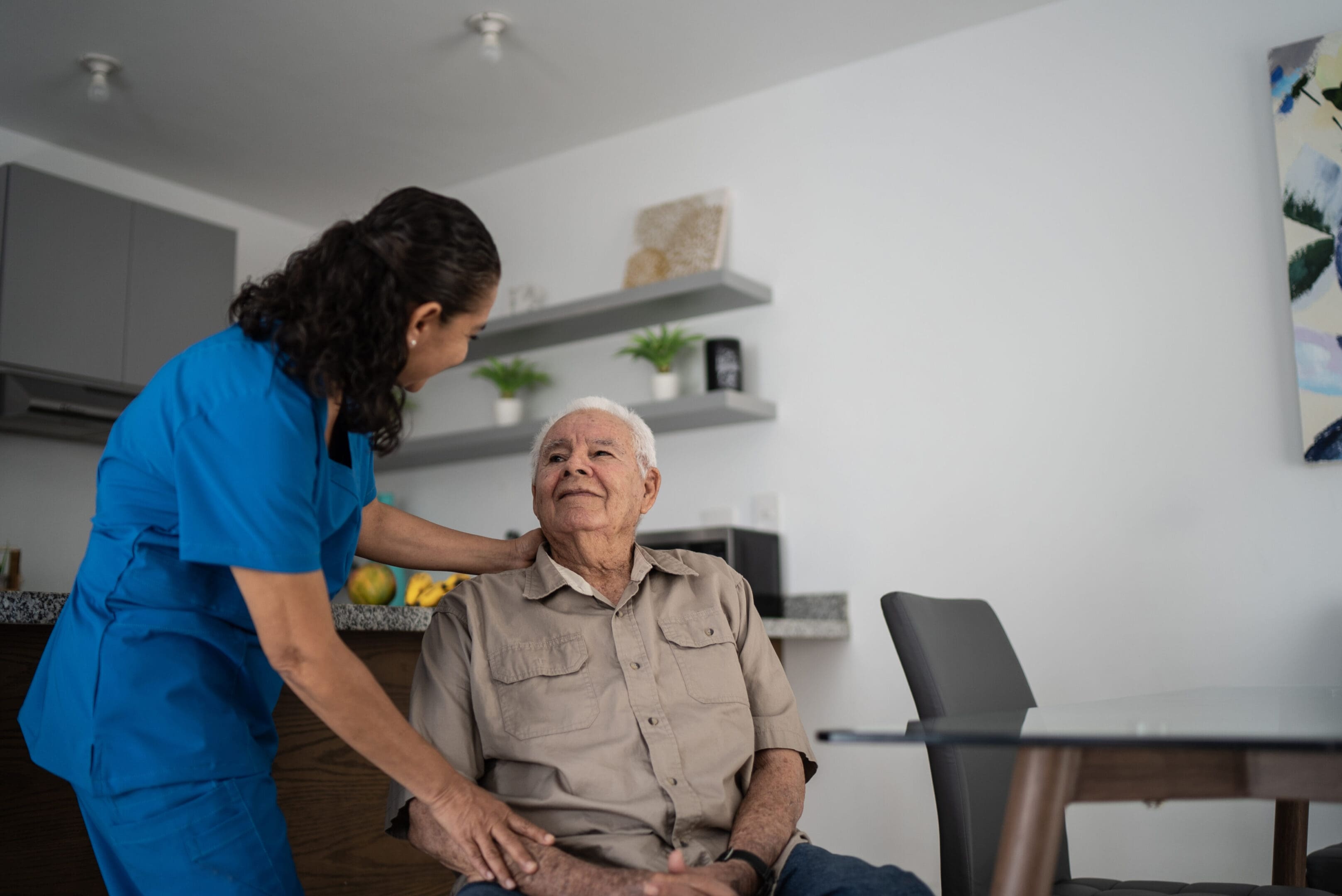 Nurse taking care of senior man at home