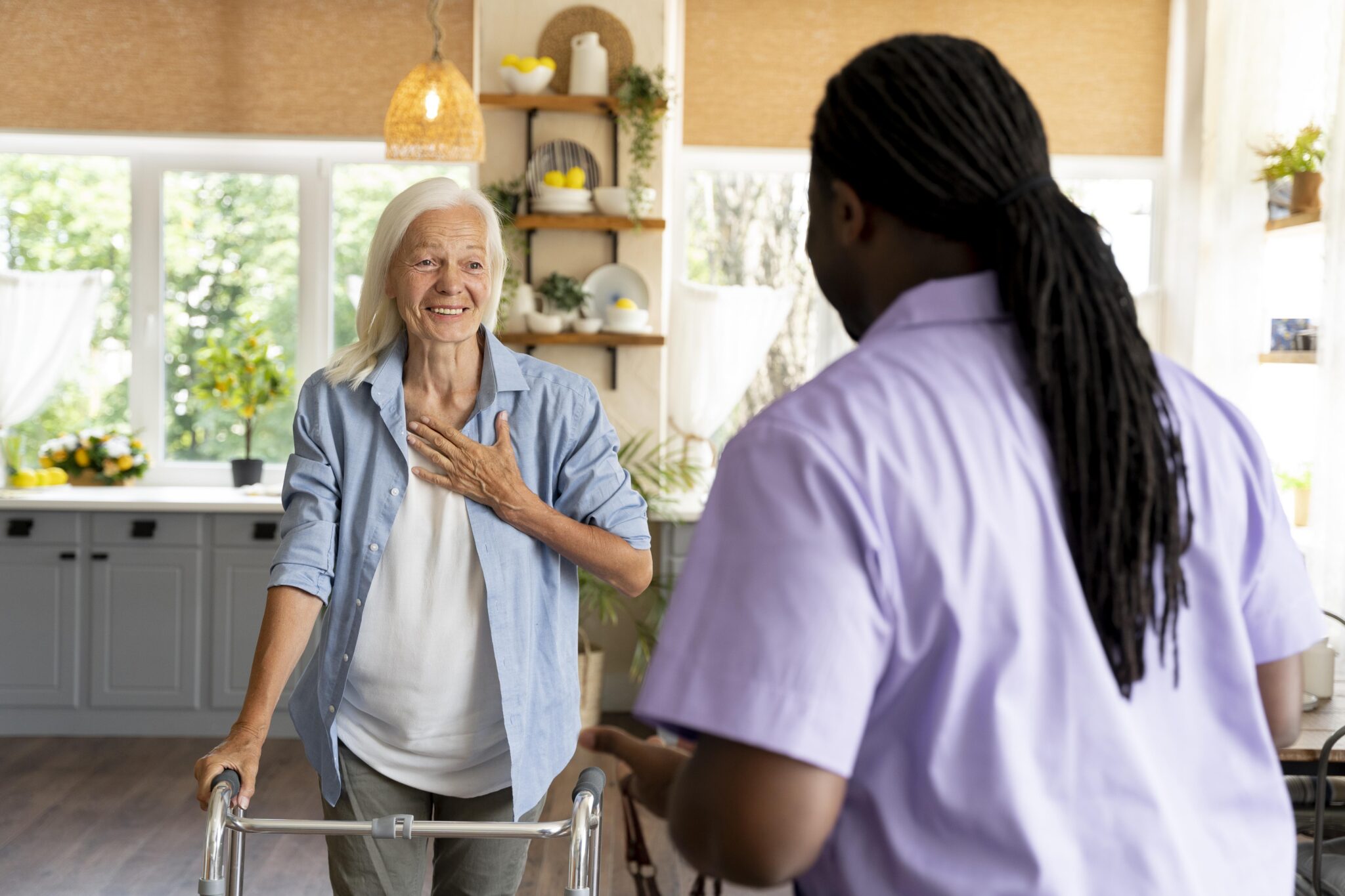 african-social-worker-taking-care-senior-woman